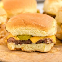 white castle sliders on top of wooden board.