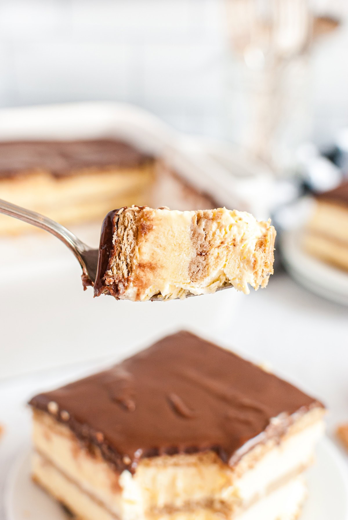 eating eclair cake with a fork. 