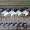 Aerial shot of hangars and fighter jets at the Air National Guard.