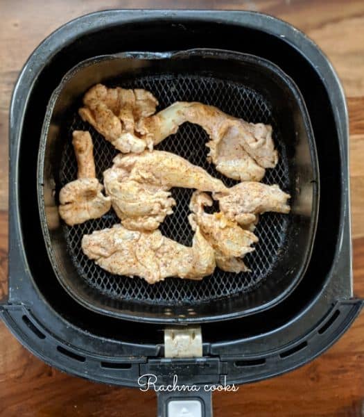 Oyster mushrooms placed in air fryer basket ready for air frying.