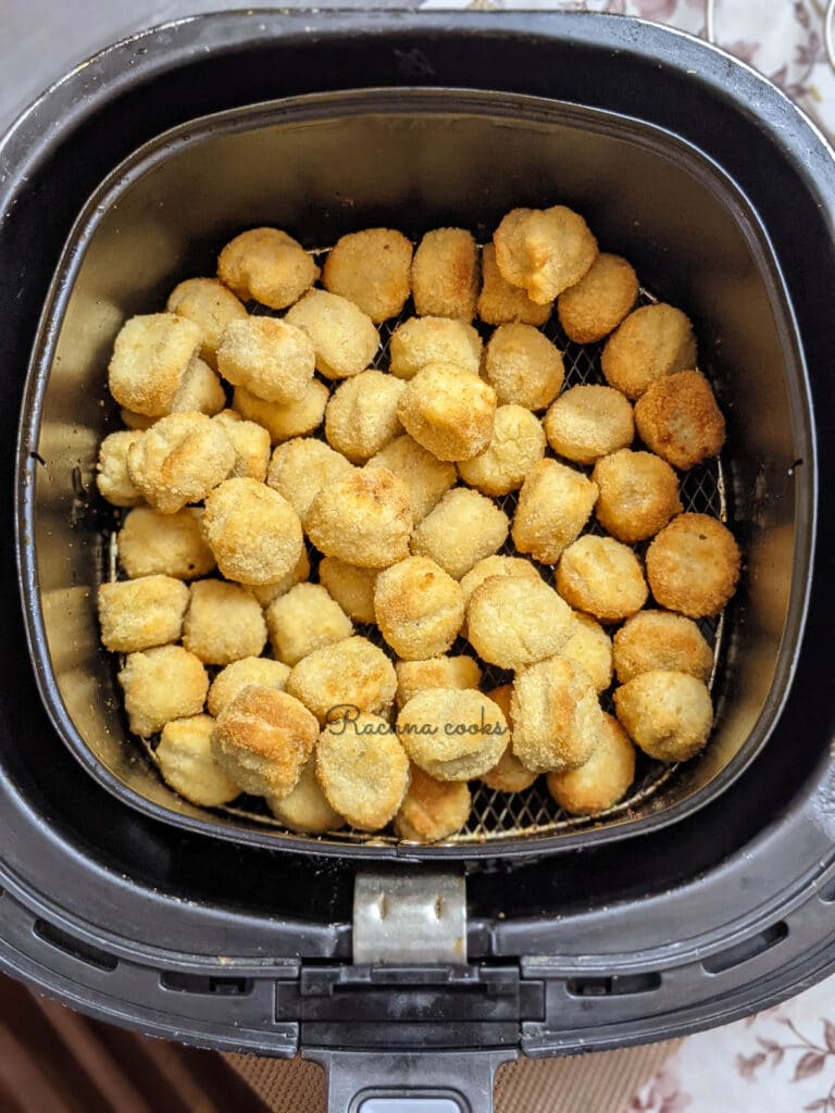 golden air fried popcorn chicken ready in the basket 