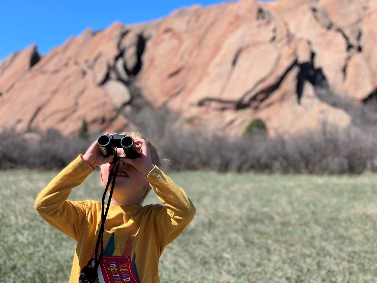 boy using binoculars