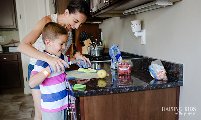 mom and son packing school lunch