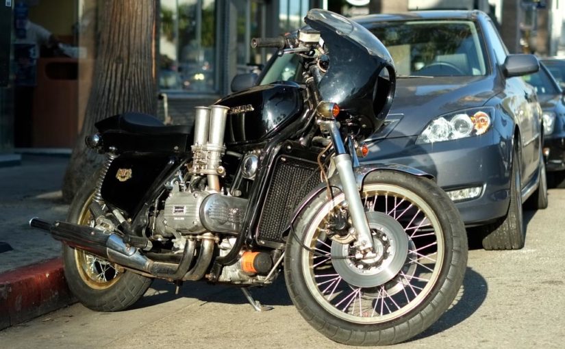 A well worn street fighter Goldwing with a set of Velocity Stacks attached to the carbs.