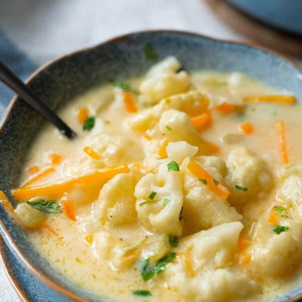 Creamy cauliflower soup is overloaded with tender cauliflower, carrots in a cheesy soup base.