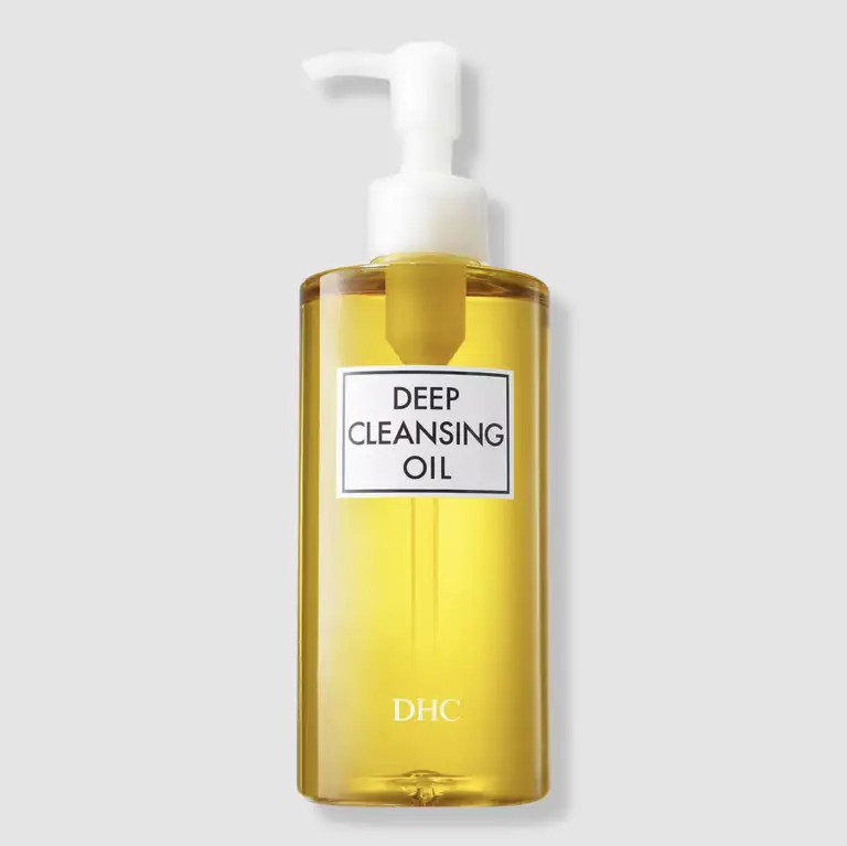 a bottle of dhc deep cleansing oil on a white background