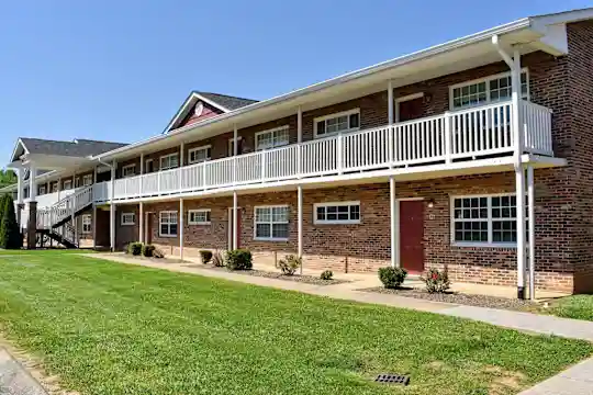 back of house with an expansive lawn