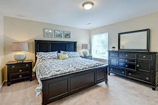 carpeted bedroom featuring natural light