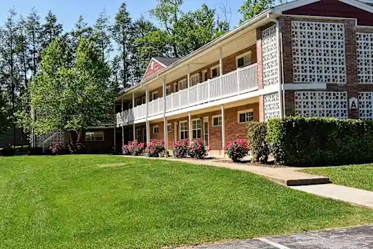 view of building exterior with an expansive lawn