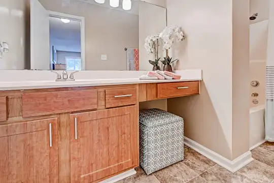 bathroom with tile flooring, oversized vanity, bathing tub / shower combination, shower curtain, and mirror