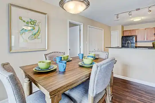 dining room featuring hardwood flooring and refrigerator