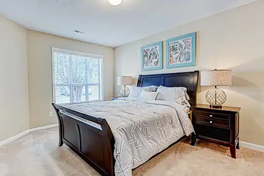 bedroom featuring carpet and natural light