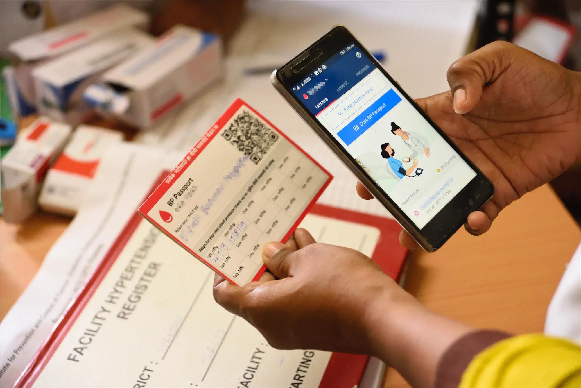 A patients blood pressure details being scanned on to a mobile phone