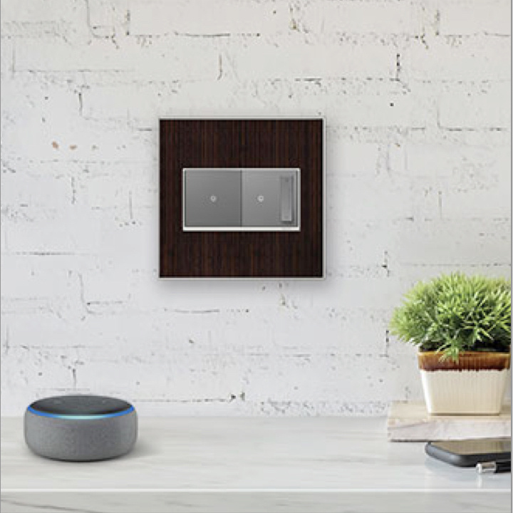 adorne Touch Smart switch and dimmer with wooden designer wall plate on white brick wall next to Amazon Echo