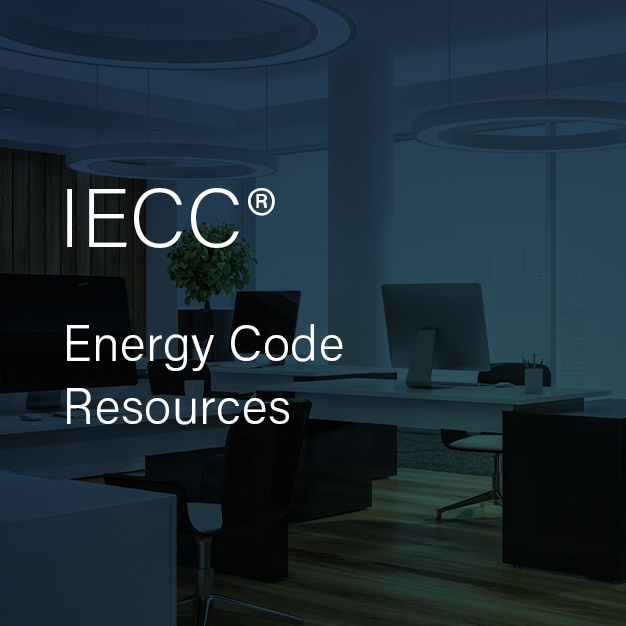 Image of office space that includes computers on desks. The text reads "IECC Energy Code Resources"