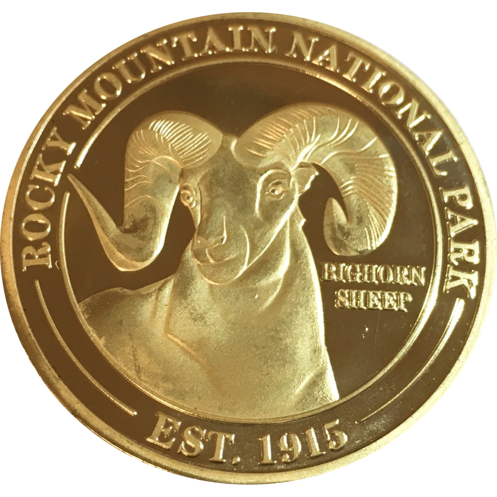 A Collectible Coin - RMNP Gold Ram with a ram on it.