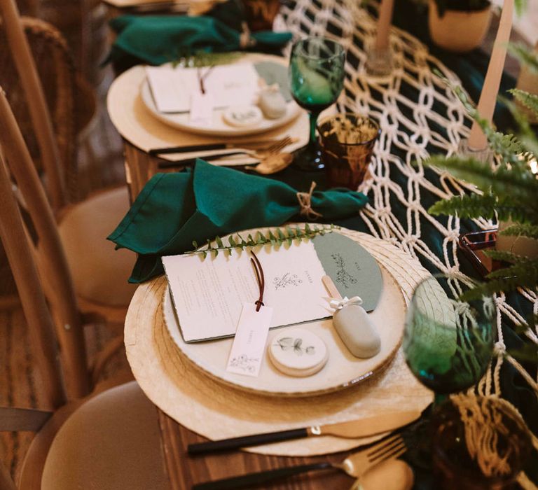 Botanical wedding with green colour palette with wicker place mat, green napkin with edible wedding favour place mats 