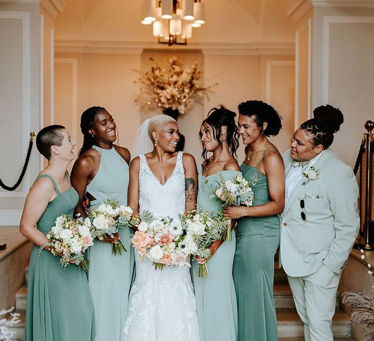 Sant Ffraed House wedding with bridal party wearing mismatched wedding outfits from mint green suit to green bridesmaid dresses