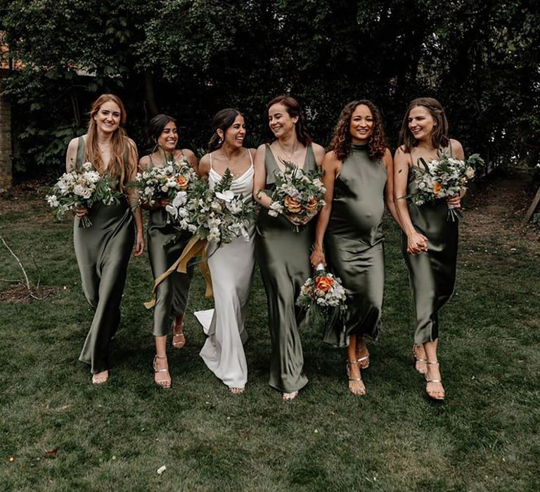 Bridesmaids in dark olive green satin bridesmaid dresses for green wedding theme idea 