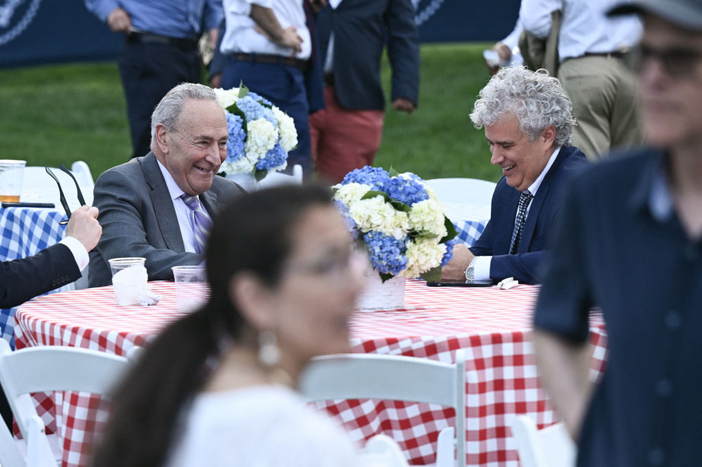 Senate Majority Leader Chuck Schumer, D-N.Y., and White House Chief of Staff Jeff Zients, right, attend the annual congressional picnic on the South Lawn of the White House on Tuesday. 