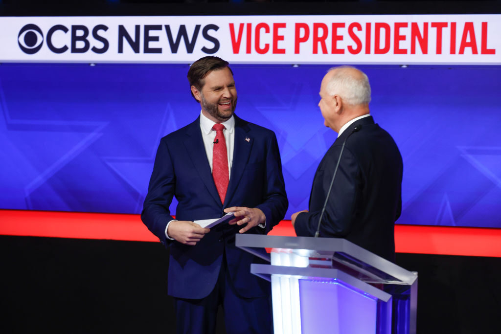 Sen. JD Vance, R-Ohio (left), speaks with Gov. Tim Walz, D-Minn., after their vice presidential debate on Tuesday in New York City. This is expected to be the only vice presidential debate of the 2024 general election.