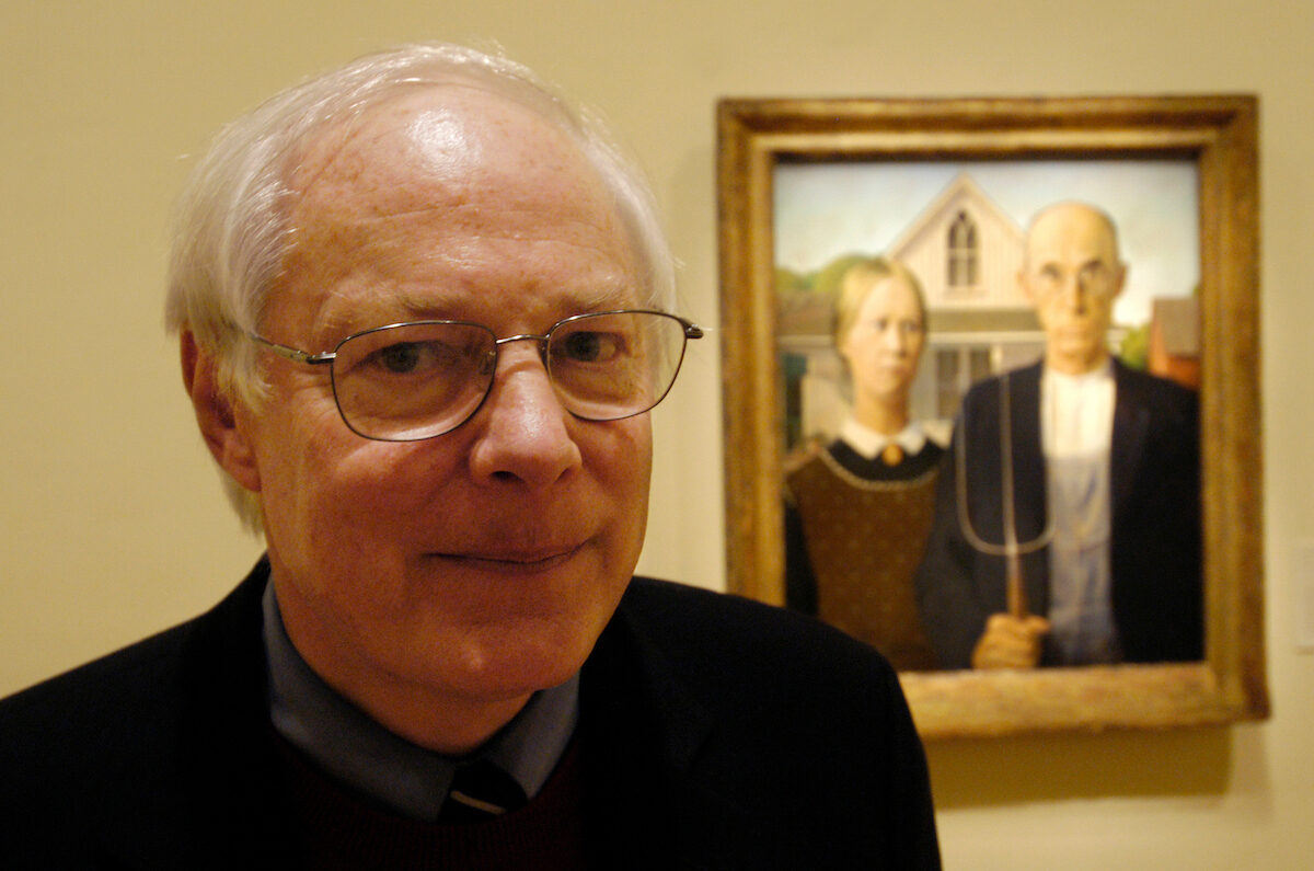 Rep. Jim Leach, R-Iowa, poses in front of  Grant Wood's "American Gothic" at the Renwick Museum in Washington in 2006. Wood painted much in Leach's district. Leach, who died Dec. 11, went on to head the National Endowment for the Humanities after leaving Congress. 