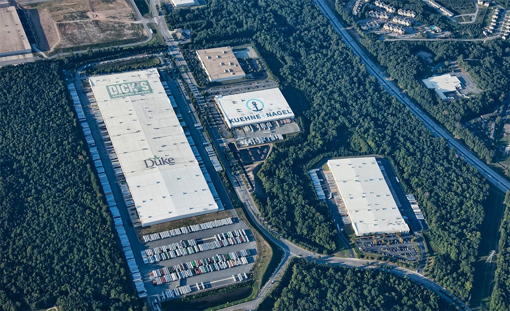 Aerial shot of Roof Logos for Dick's Sporting Goods, Duke Realty and Kuehne + Nagel in close proximity to one another