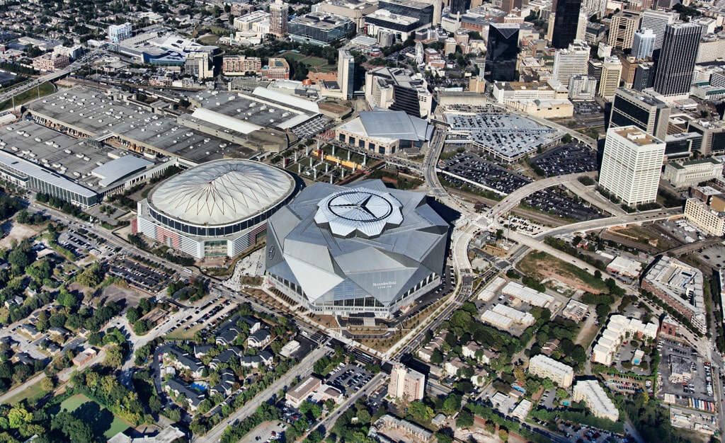 Aerial shot of Mercedes-Benz stadium in Atlanta, Georgia with Mercedes-Benz logo featured on skylight, applied by Roof Logos