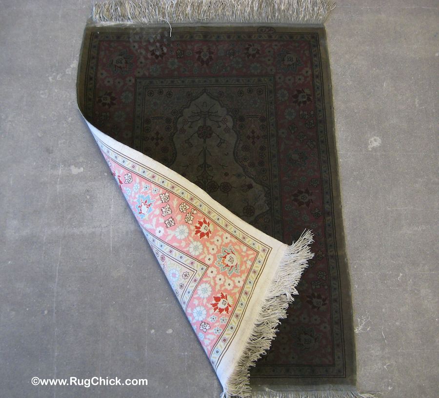 This Turkish Hereke silk rug was on a table in a home that burned down. Comparing the back to the front.