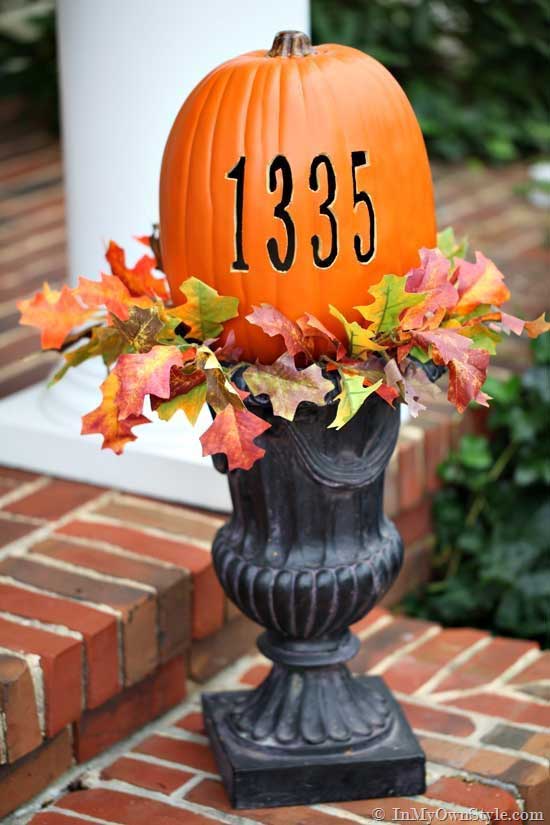 carved out address numbers in a pumpkin