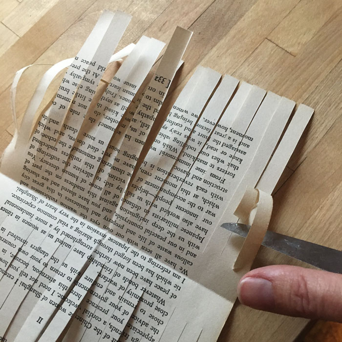 curled book page strips