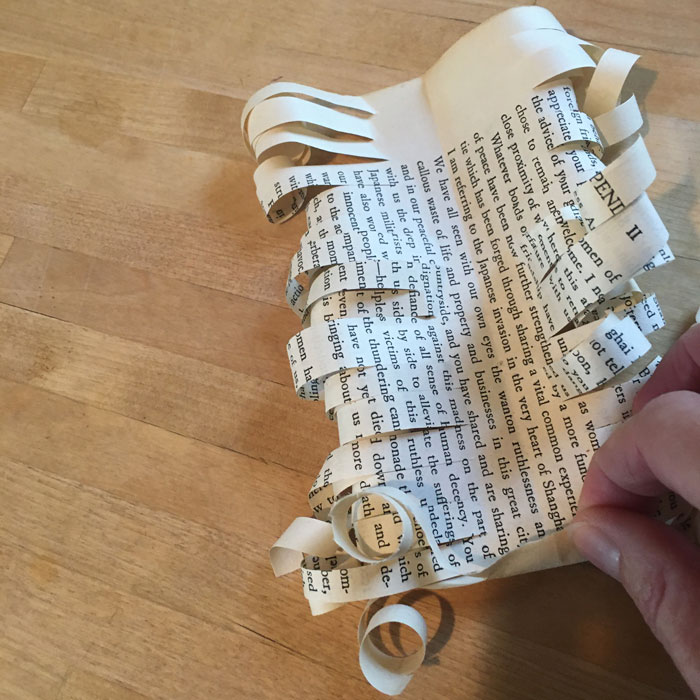 rolled book page bow