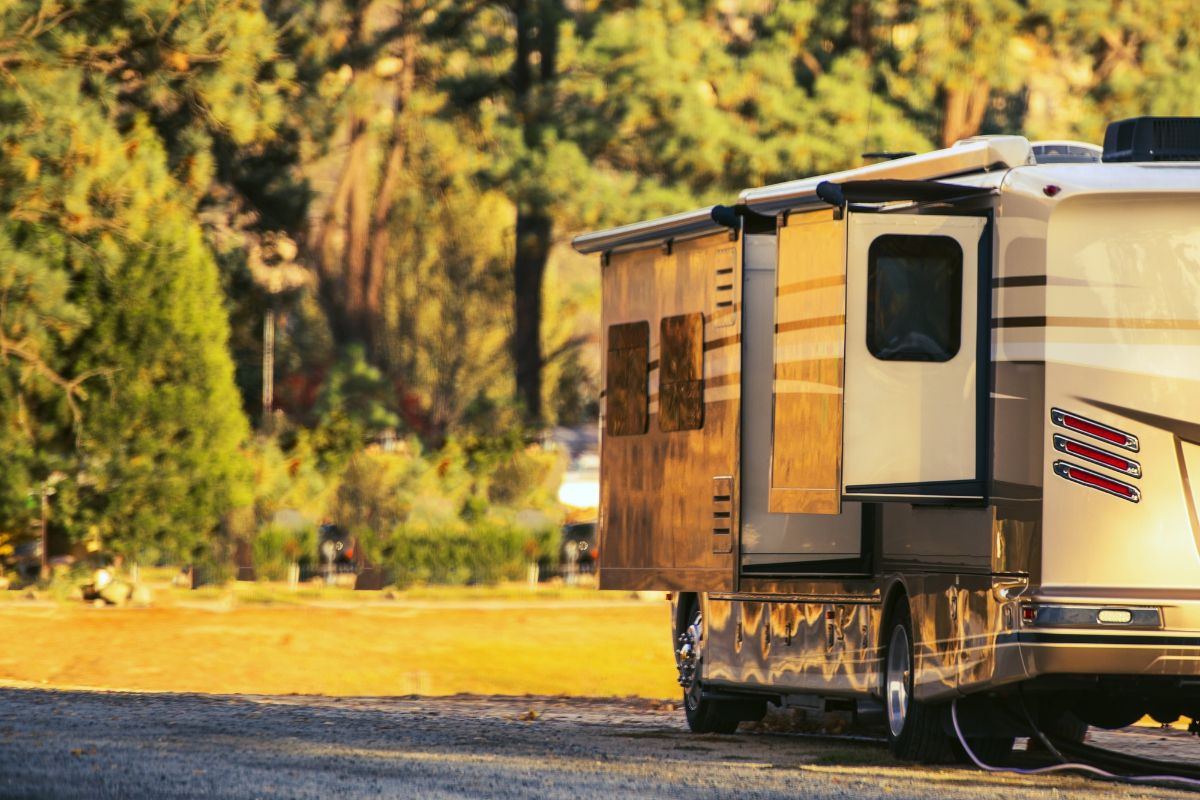 RV parked on side way with extended slide out.