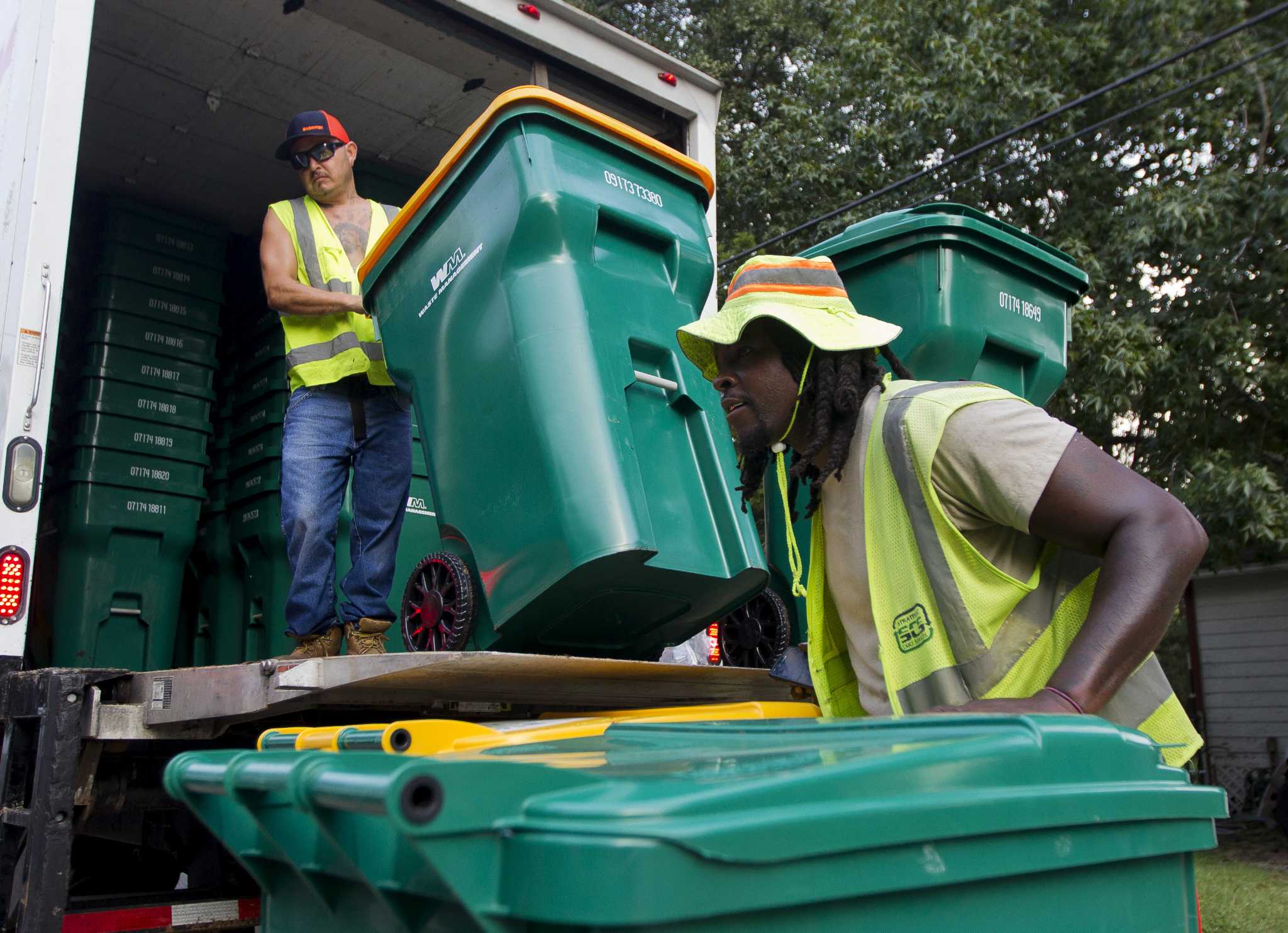 Waste Management delivers new trash cans, service in Conroe