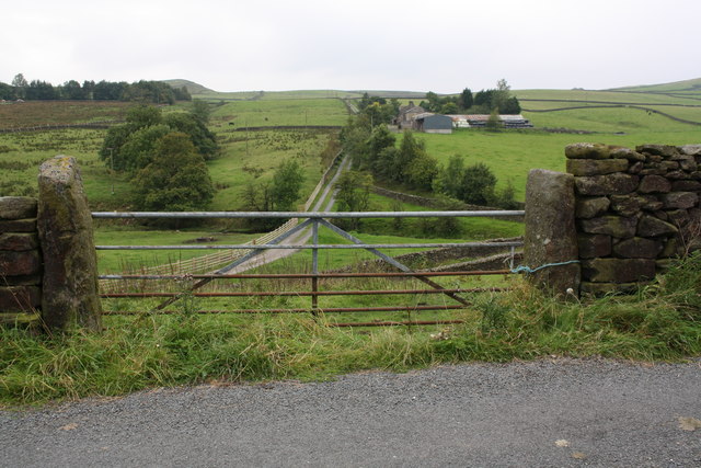 Upper Sheep Wash farm viewed through field gateway west of Upper Sheep Wash