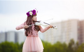 Girl play a white violin