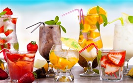 Many kinds of cocktails, strawberries, oranges, glass cups