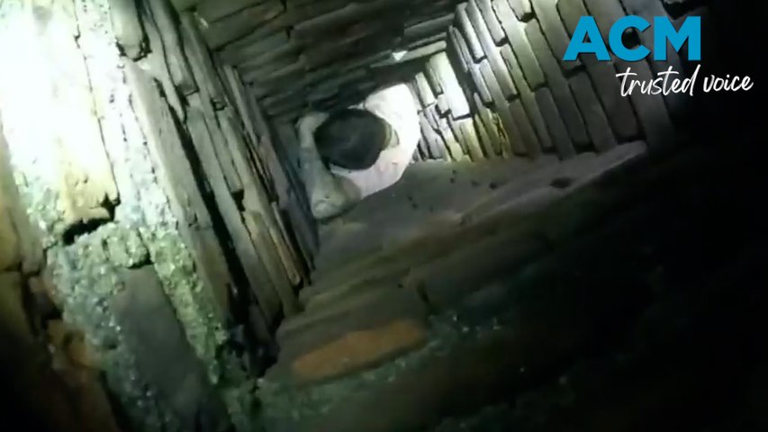 A suspect attempting to evade police became stuck in a chimney, they were extricated by a local fire crew before being arrested. Video by City of Fall River Police Department via Storyful.