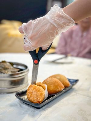 Photo of Blooming VIP Restaurant - Rosemead, CA, US. cutting the dumpling