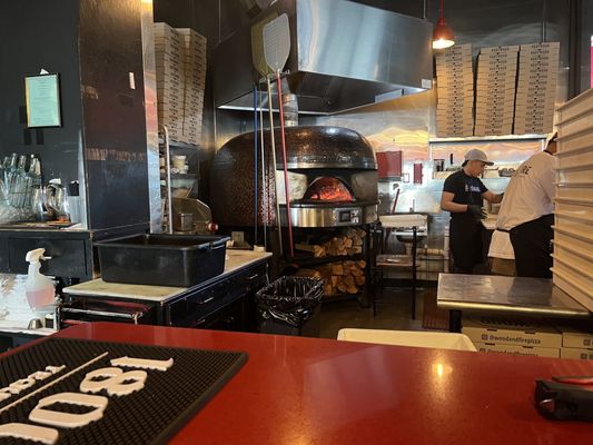 Photo of Wood & Fire Neapolitan Style Pizza - Pleasantville, NY, US. two men in a kitchen