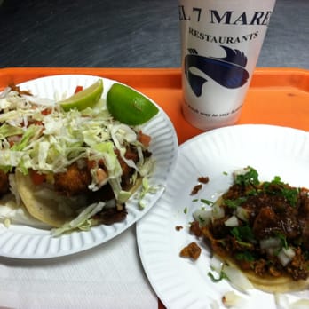 Dos fish tacos, a taco al pastor and horchata for like $8.