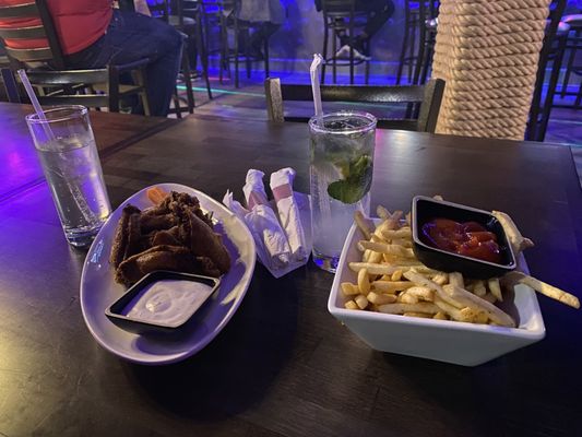 Photo of Edge Restaurant & Lounge - New York, NY, US. Plain fried wings and French Fries  Sprite and Mojito