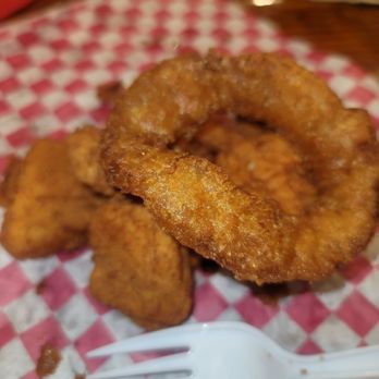 Excellent onion rings with catfish nuggets underneath it