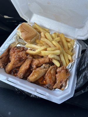 Photo of Bethune Grill - Daytona Beach, FL, US. Wings, fries and roll