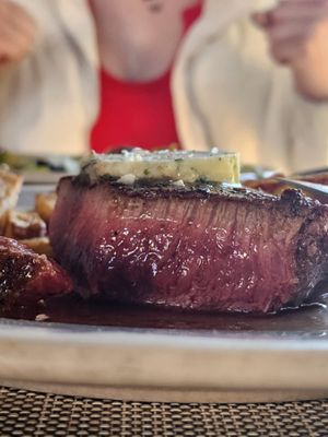 Photo of Caprice Cafe - Redlands, CA, US. Prime Brandt Farms Flat Iron Steak rare