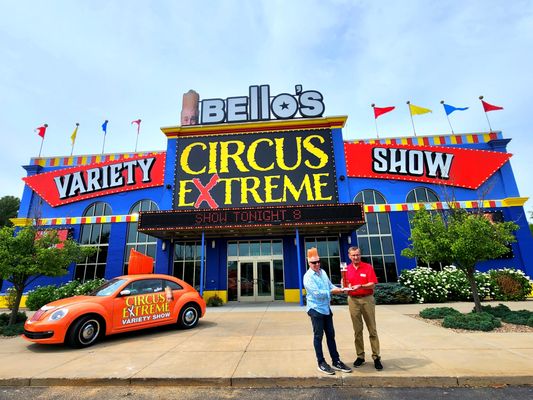 Photo of Christmas in the Dells Dinner Show - Wisconsin Dells, WI, US. two people standing in front of a circus extreme