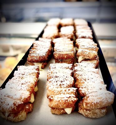 Photo of Rikopan Brazilian and Portuguese Bakery - Bridgeport, CT, US. a tray of pastries