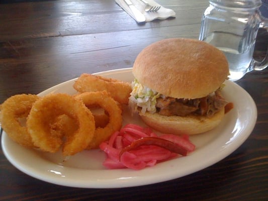 Photo of The Fremont Diner - Sonoma, CA, US. Pulled Pork Sandwich with Big River BBQ Sauce, Chopped Cole Slaw and Onions Rings, a bargain at $8.25