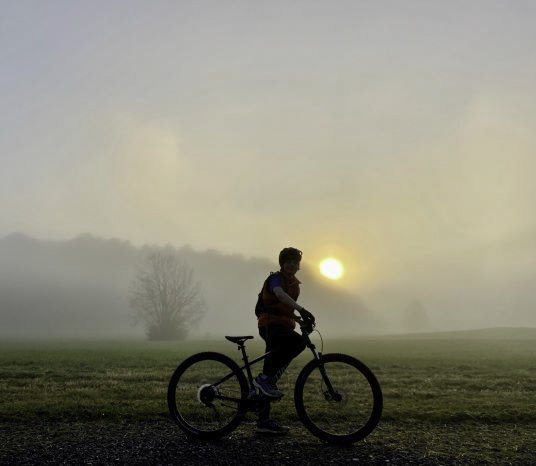 Photo of Embark Behavioral Health - Benton, TN, United States. Teen struggling with depression mountain biking as a therapeutic activity near Embark at The Forge.