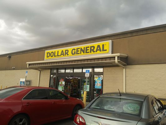 Photo of Dollar General - Tampa, FL, US. two cars parked in front of a dollar general store